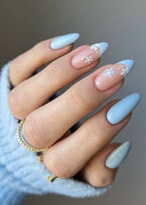Light Blue Floral Nails 
https://outfitonpoint.com/these-light-blue-flower-nails-are-pure-cottagecore-magic/